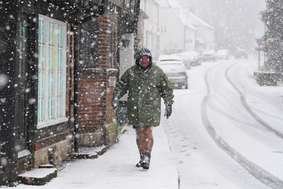 A man braves the snow flurry in Lenham, Kent earlier this week