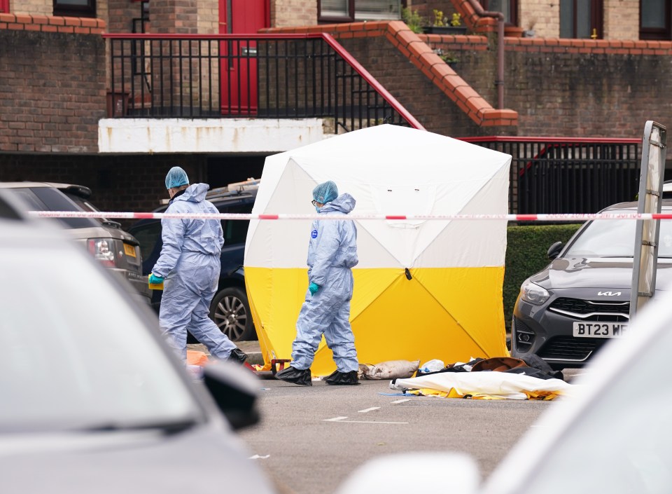 Forensics officers could be seen working next to a white tent