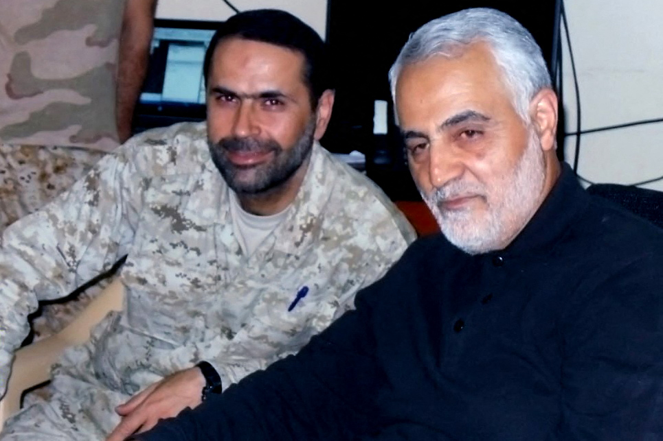 Al-Tawil is pictured alongside slain Iranian general Qasem Soleimani