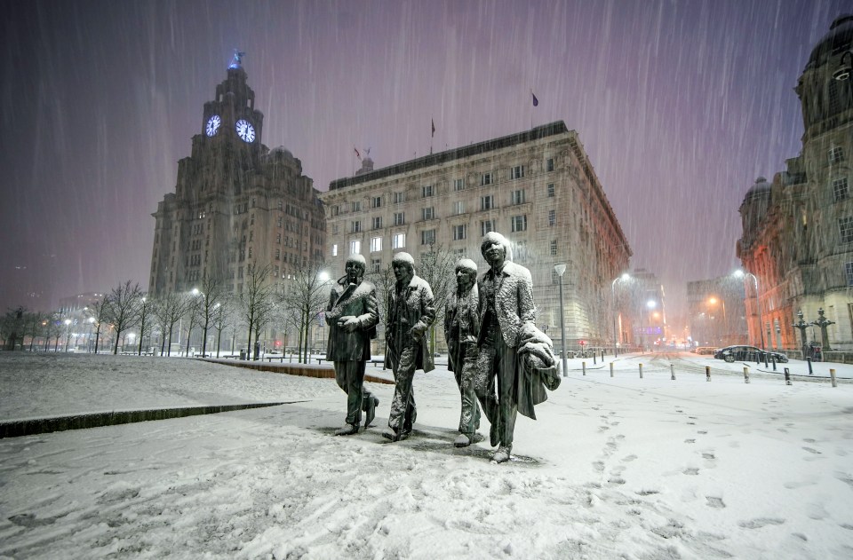 Wintery scenes on the Beatles Statue at Pier Head, Liverpool