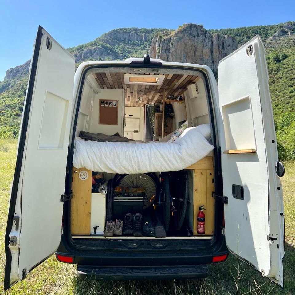 The van boats under-bed storage where the couple keep their shoes and bikes