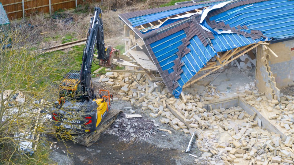 A demolition excavator tore down the property in Marston Moretaine