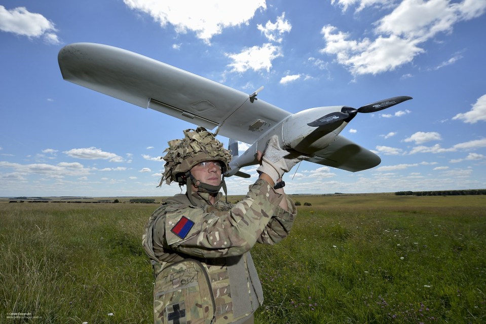 A soldier from the Royal Artillery prepares to launch the Desert Hawk 3 UAS (Unmanned Air System) over Salisbury Plain during a training exercise...Desert Hawk is an extremely versatile and small Unmanned Aerial System designed for discrete operations. It is operated normally at the company level but is equally well employed above and below this. It has an extremely good record proven over the last year and is currently supporting 16 Air Assault Brigade in Afghanistan. It provides an excellent 'over the hill' view for commanders on the ground....-------------------------------------------------------.© Crown Copyright 2014.Photographer: Cpl Si Longworth RLC (Phot).Image 45157710.jpg from www.defenceimages.mod.uk....Use of this image is subject to the terms and conditions of the MoD News Licence at www.defenceimagery.mod.uk/fotoweb/20121001_Crown_copyright_MOD_News_Licence.pdf ..For latest news visit www.gov.uk/government/organisations/ministry-of-defence.Follow us: .www.facebook.com/defenceimages.www.twitter.com/defenceimages