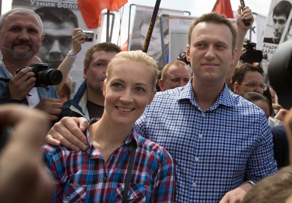 Navalny and his wife Yulia attend an opposition rally outside the Kremlin in Moscow