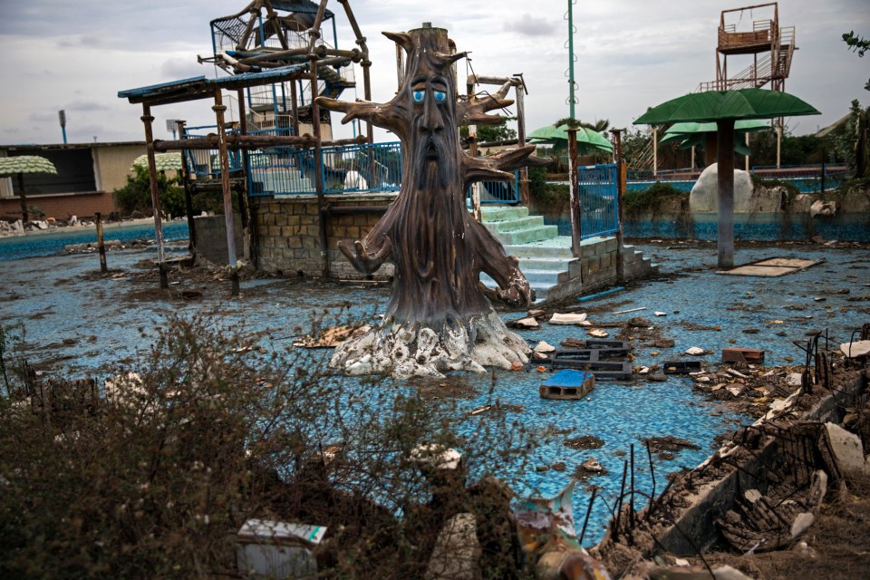 Like much of the site, a forest-themed playground now lies in tatters