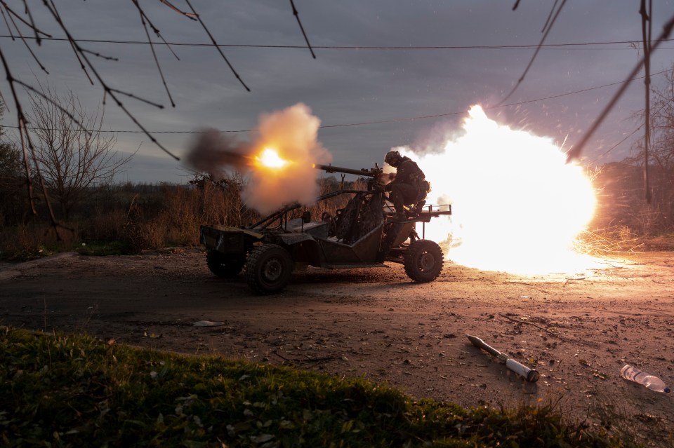 Ukrainian troops shoot at Russian positions on the frontline near Kherson