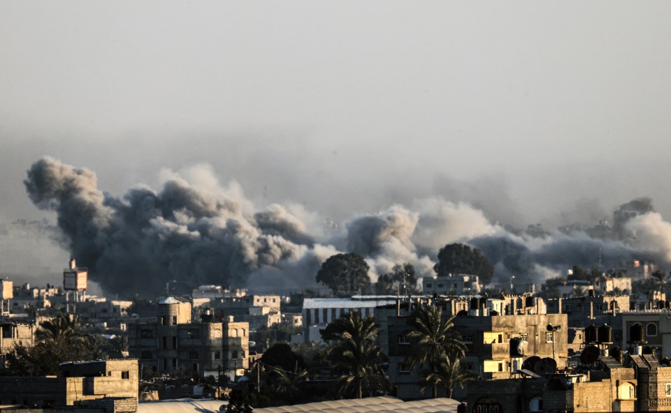 The war between Israel and Hamas rages on in the Gaza Strip - smoke billows over the besieged enclave on January 22, 2024