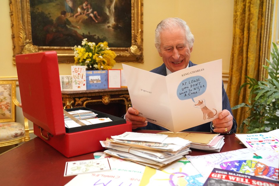 The King enjoys a giggle as he looks through some of the more than 7,000 get well cards sent by well-wishers from around the world