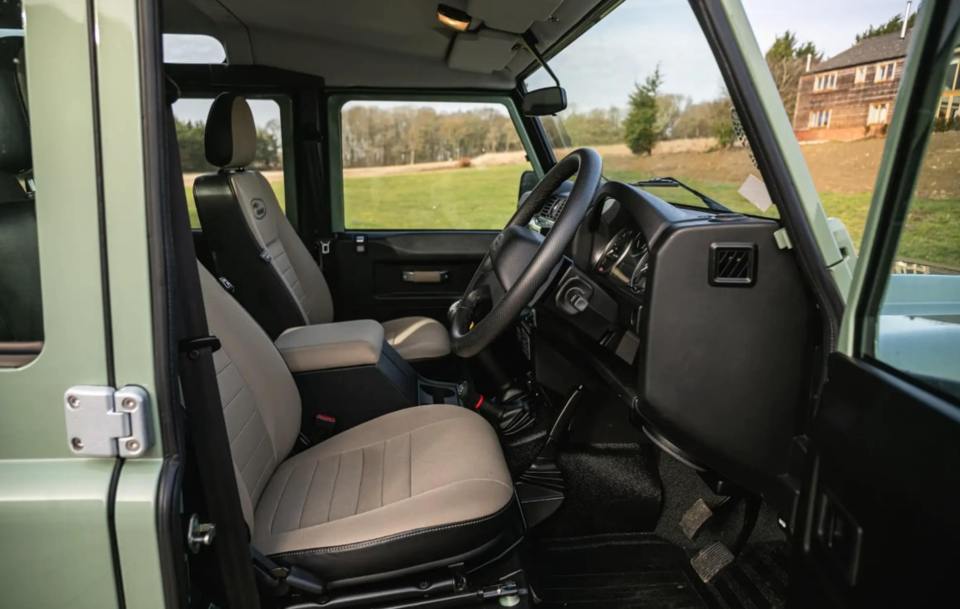 The seats are covered with almond upholstery and crested with the Heritage logo