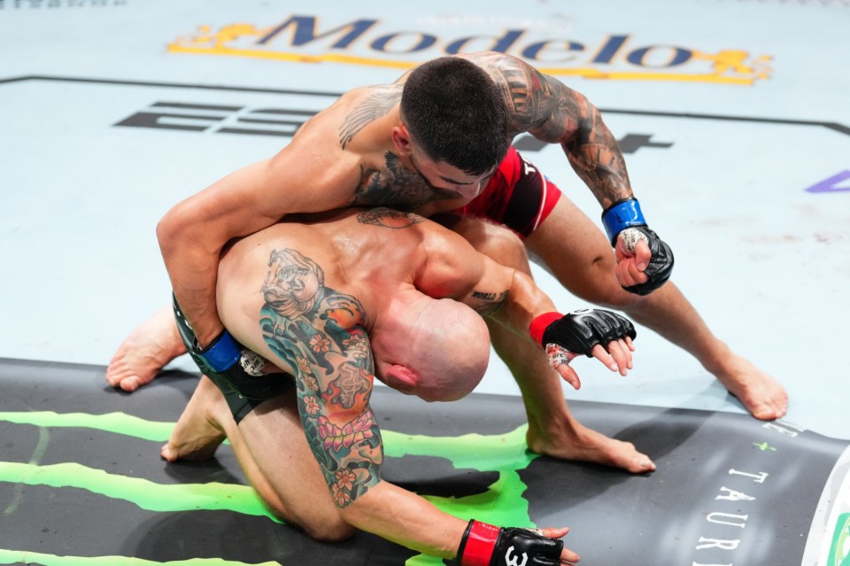 JACKSONVILLE, FLORIDA - JUNE 24: Ilia Topuria of Germany (top) punches Josh Emmett in their featherweight fight during the UFC Fight Night event at Vystar Veterans Memorial Arena on June 24, 2023 in Jacksonville, Florida. (Photo by Josh Hedges/Zuffa LLC)