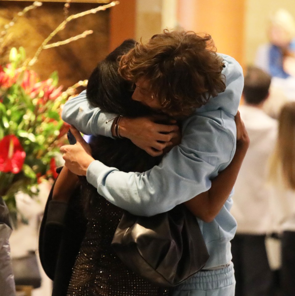 The pair shared a warm hug in the hotel