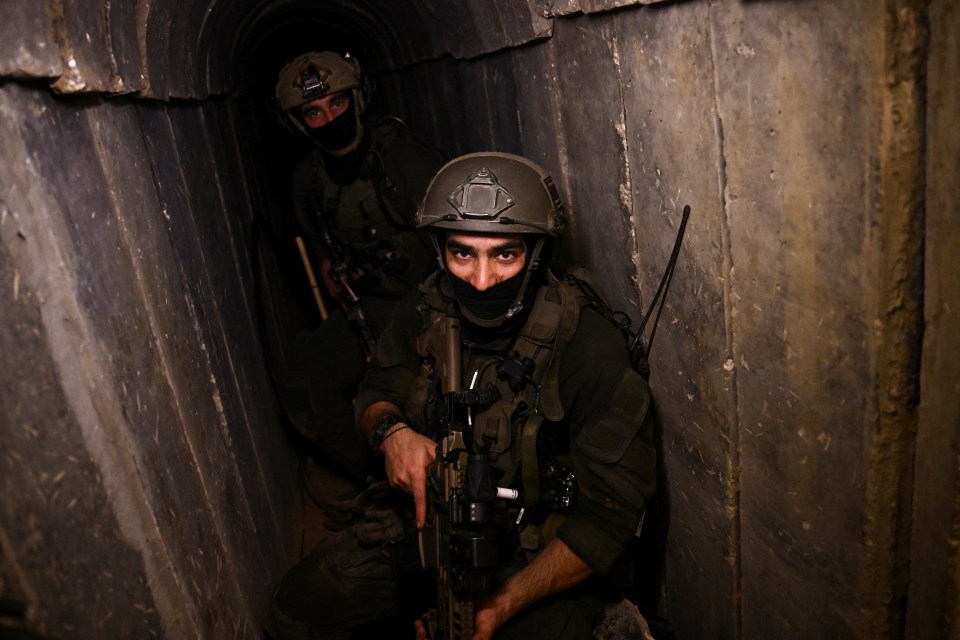 Israeli soldiers move through a Hamas command tunnel, on February 8