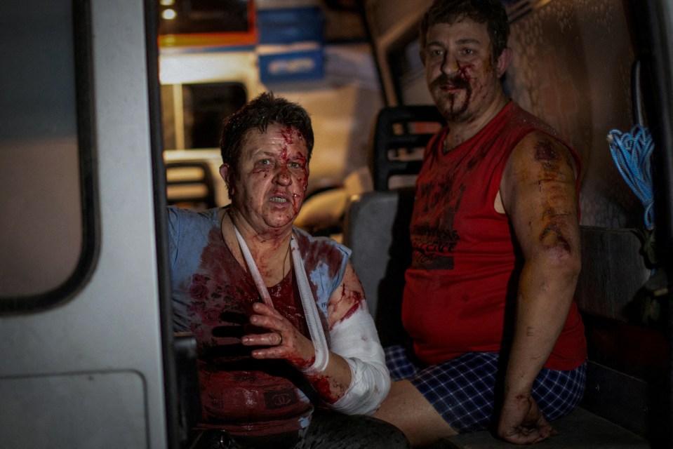 Ukrainian civilians injured during a Russian military strike are seen inside an ambulance