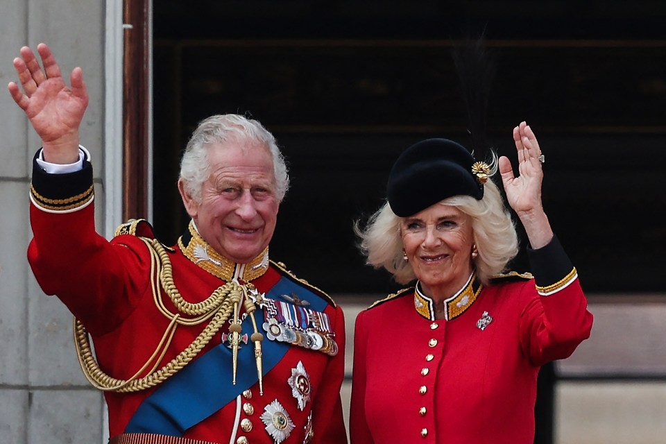 Charles and Camilla wave from the balcony of Buckingham Palace after attending the King’s Birthday Paradein June last year