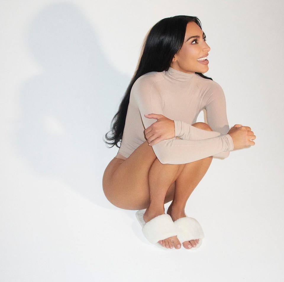 Kim uses her arms to form a protective barrier, and shows signs of vulnerability