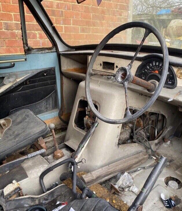 The gearstick and steering wheel are covered in rust