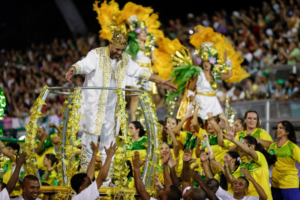 The 'Emperor of Milan' stole the show as he was decked out in a robe and crown on the huge float