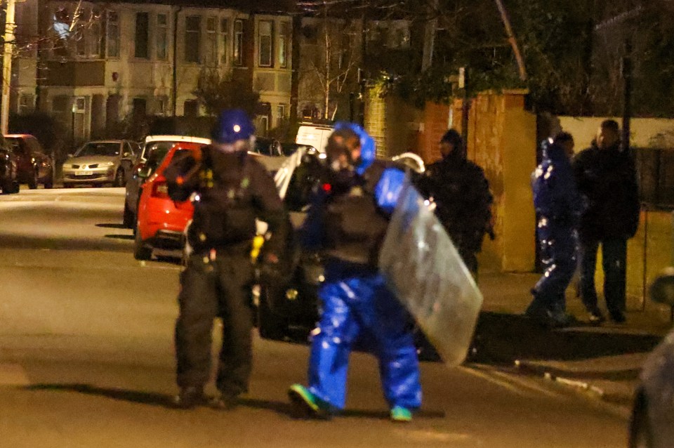 Officers wearing hazmat suits raided an address in east London