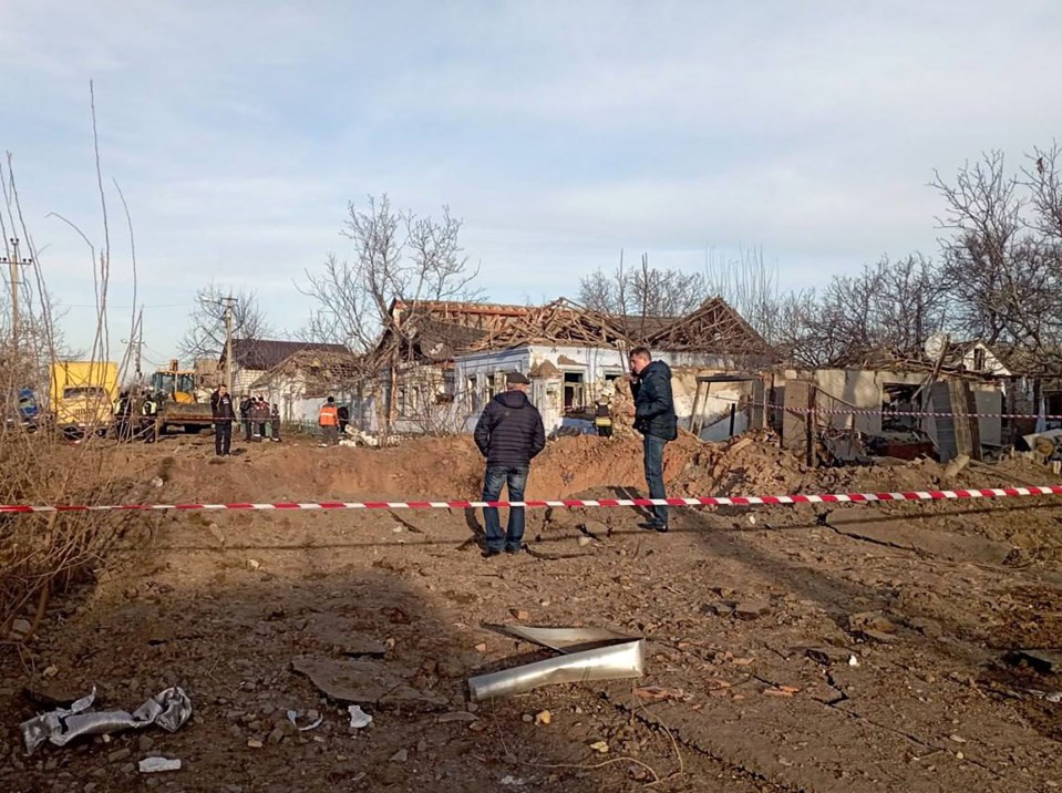 Houses were left in tatters as debris was flung across Ukrainian cities after the explosions