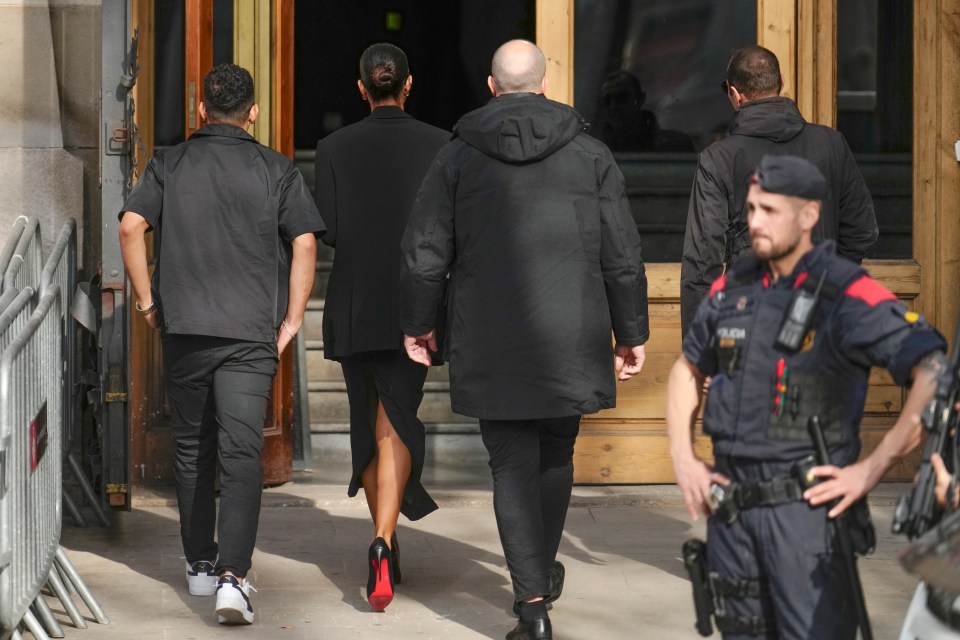 Sanz was flanked on both sides as she walked into court today dressed in head-to-toe black