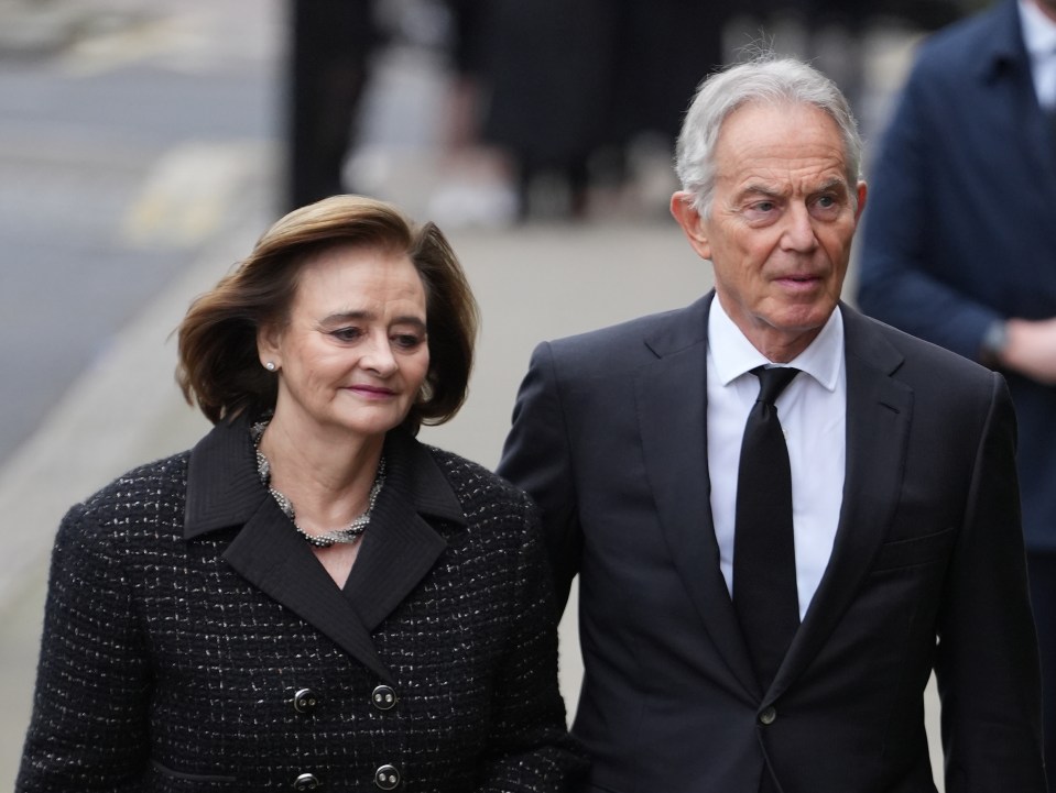 Former PM Tony Blair and his wife Cherie arrive at the funeral of the former Labour politico