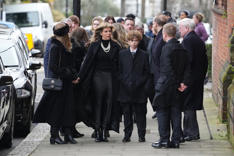 Kate arrives at the funeral with children Darcey (left) and Billy (right)