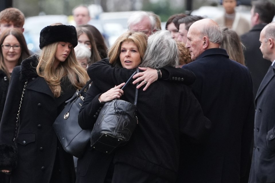 Television host Kate greets mourners as she arrives at the Primrose Hill church