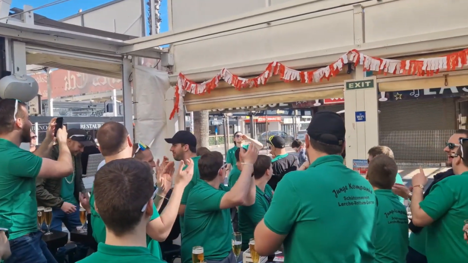 The group was filmed singing and cheering as they drank their pints