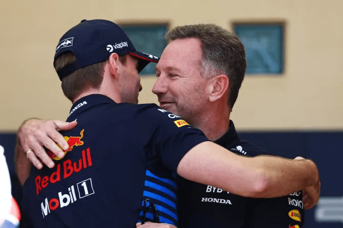 Verstappen and Horner hugging each other at the F1 paddock in Bahrain today