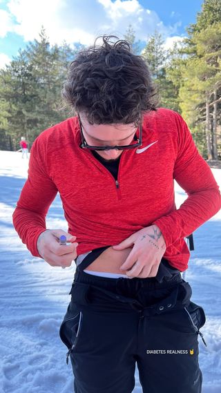 JJ Slater took a break from skiing to inject himself with insulin