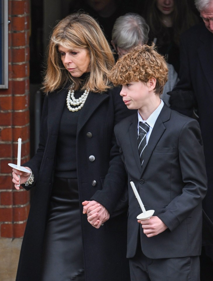 Kate Garraway left the church clutching her 14-year-old son Billy's hand