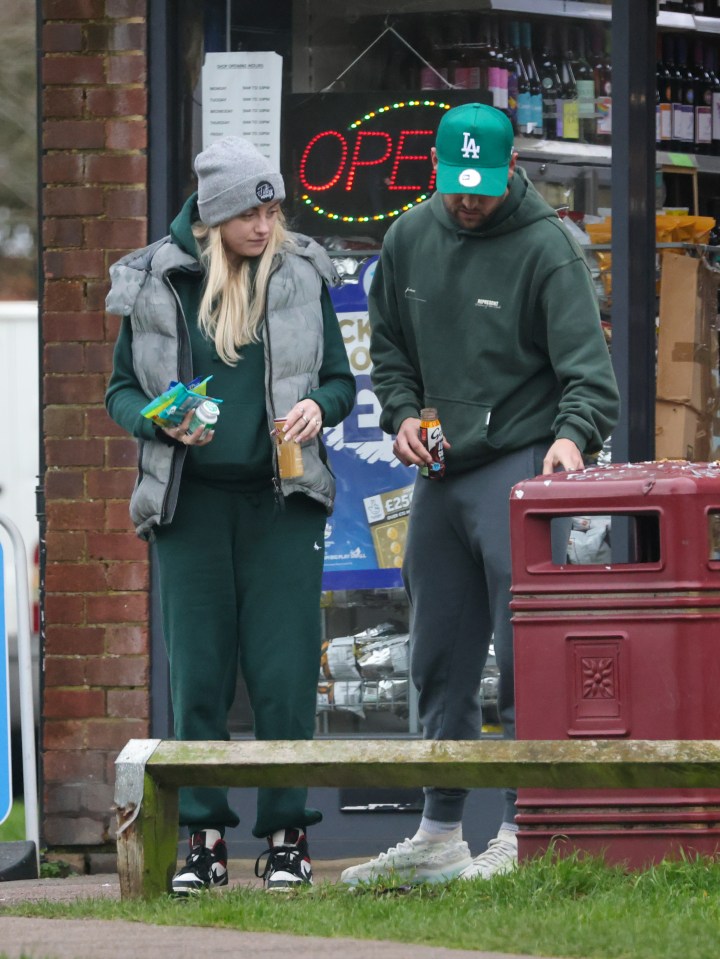 The pair dressed down in matching trackies