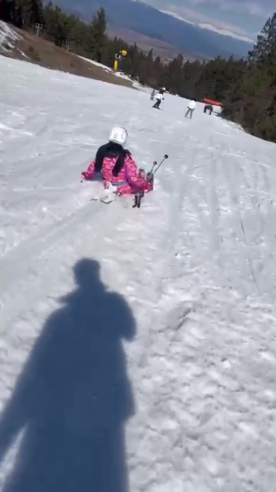 Katie slid down the slope on her skis