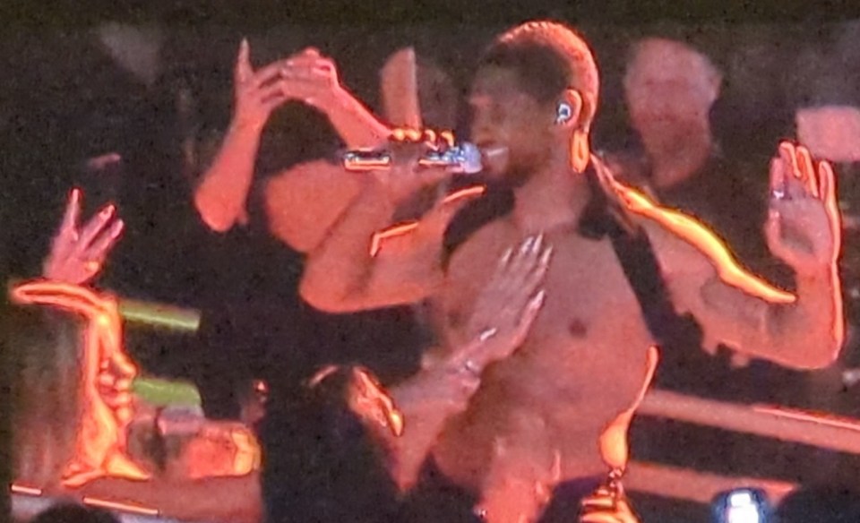 Khloe Kardashian and Kimora Lee Simmons rub Usher’s bare chest and and get fed strawberries from him as Kim Kardashian laughs in front row of his show in Las Vegas