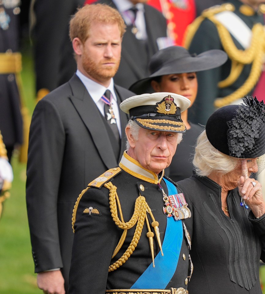 The king and Harry watch as the coffin of Queen Elizabeth II is placed into the hearse following the state funeral service in Westminster Abbey