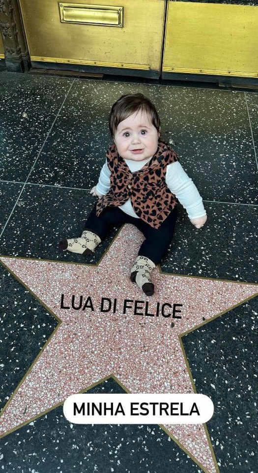 The tot posing at the Hollywood Hall of Fame