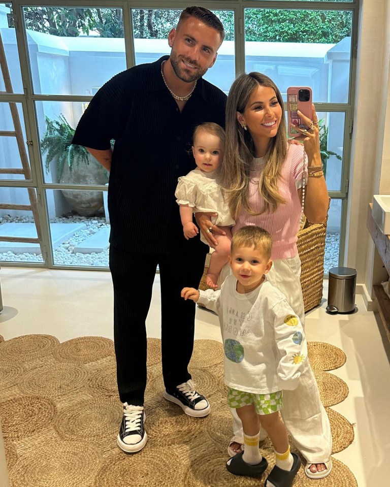 Luke Shaw and Anouska Santos are pictured with son Reign and daughter Storie