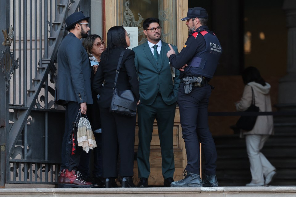 Alves’ family speaking to a court official in Barcelona