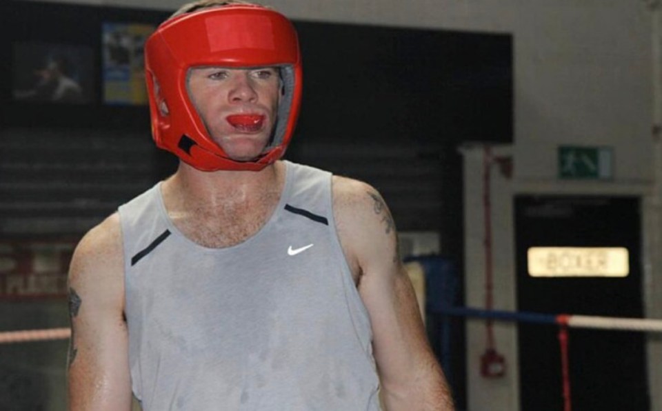 Wayne Rooney was filmed sparring with a former Manchester United player in his kitchen</p>
<p>Boxing Phil Bardsley