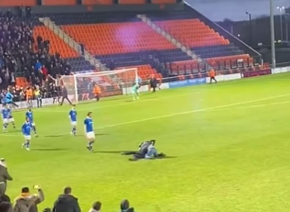 A Wealdstone fan stormed the pitch and attacked a steward trying to stop pitch invaders