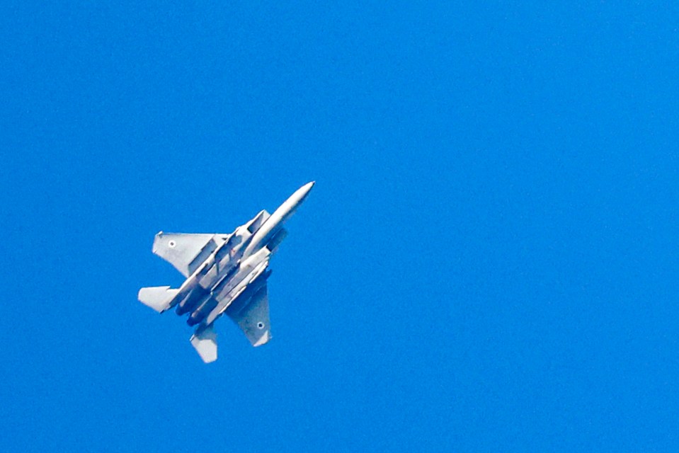 An Israeli Air Force fighter jet flies over the border area with south Lebanon