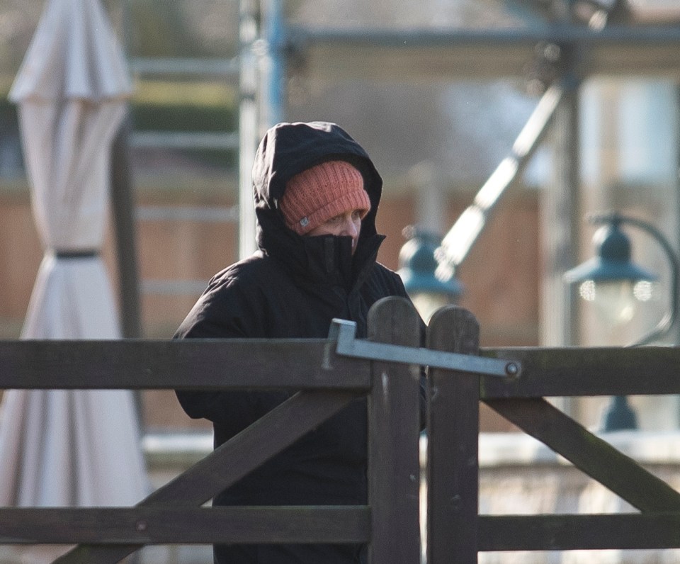 Hannah was seen in a black coat and beanie as demolition of the complex was underway