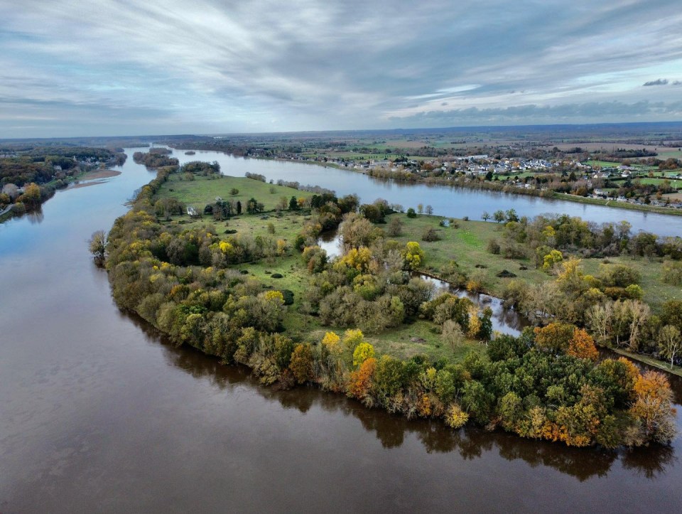 The island is surrounded by a beautiful lake and a plethora of large century-old trees