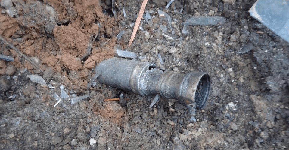 A chilling image shows a Russian rocket left in the ground after a terrifying strike