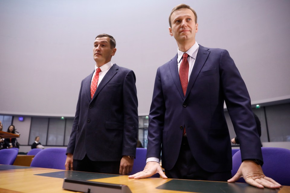 Russian opposition leader Alexei Navalny, right, and his brother Oleg