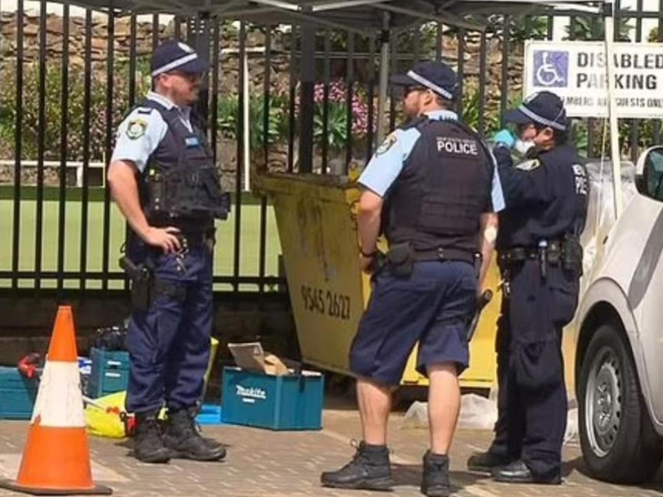 The police discovered the men's bloody belongings in a skip bin