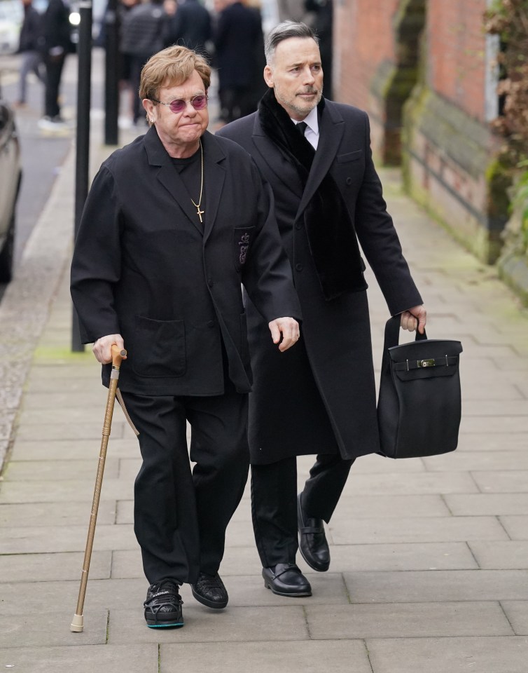 Sir Elton John who has been a friend of Kate's during the difficult period - with his partner David Furnish