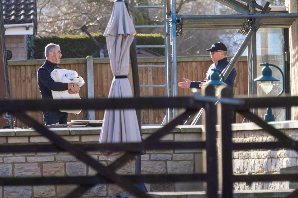 Colin Ingram-Moore (right) helping workmen remove the last remaining fittings including a toilet and sink from the spa