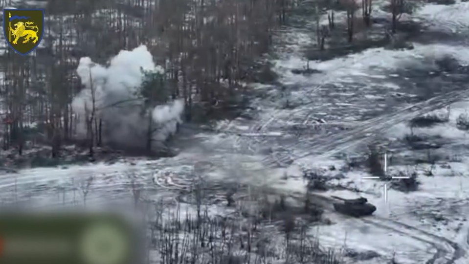 Ukrainian tanks attack Russian positions in a forest close to the frontlines around the city