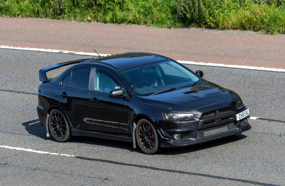 A 2008 black Mitsubishi Lancer - one of many models you can still find for less than £10,000